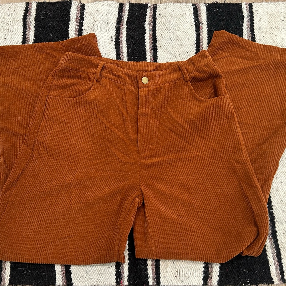 Burnt orange wide leg pants.